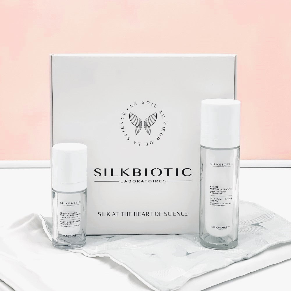 Coffret anti-âge SILKBIOTIC avec crème repair intensive, sérum regard et taie en soie.